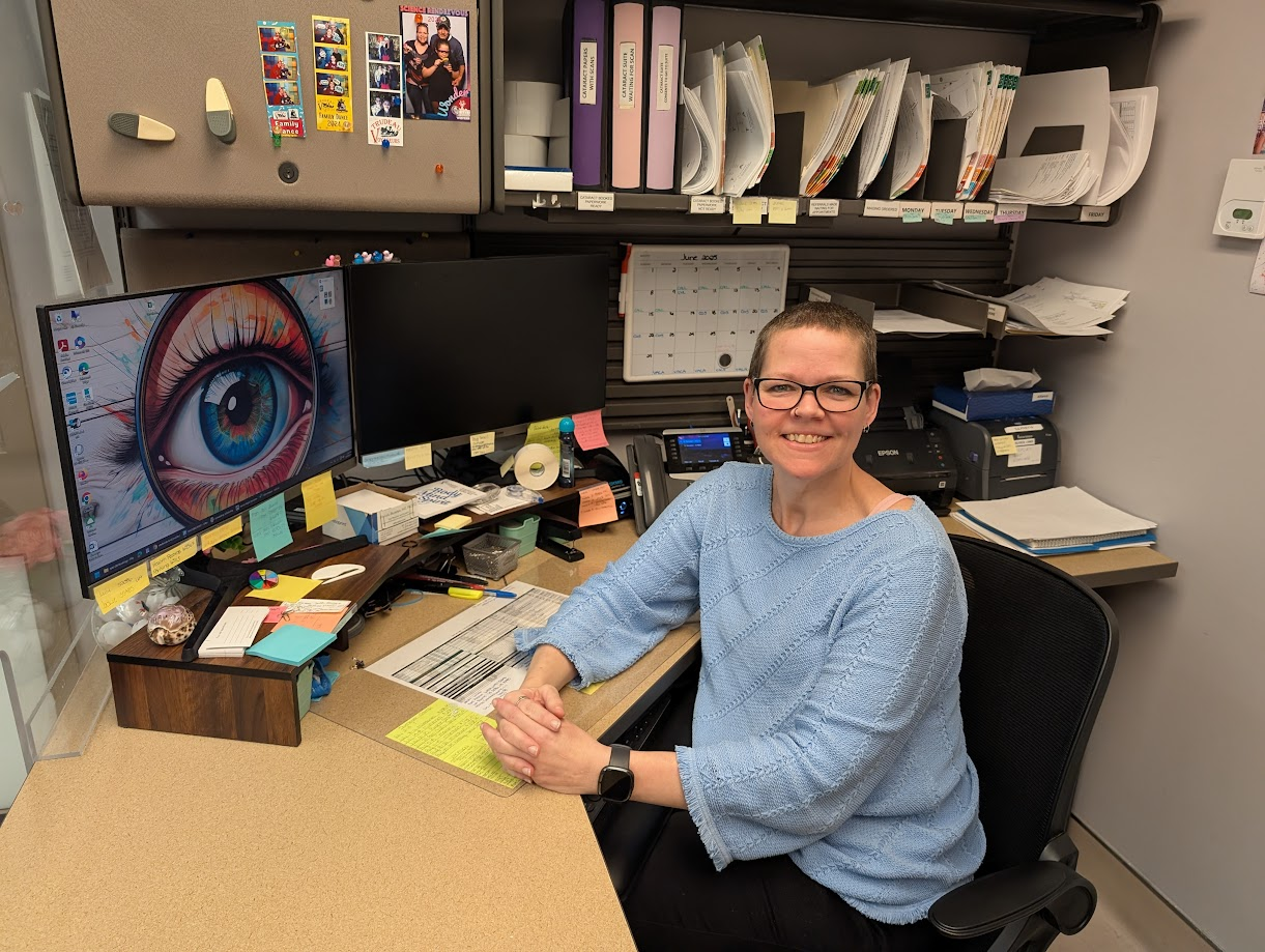 Sonya McCabe siting at main office desk